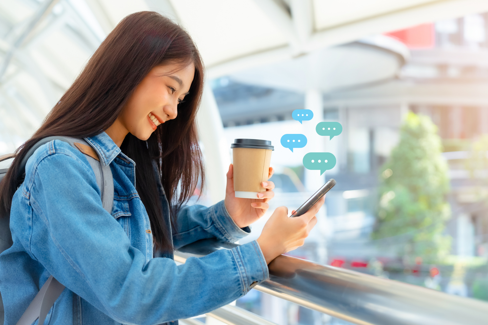 Customer chatting on phone smiling—live chat support